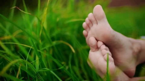 Bare feet on green grass, copy space 4k Stock Footage 72394533