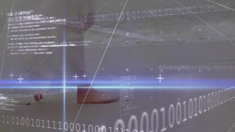 Bare feet standing on wet sand while binary code streaming across glowing Stock Footage 309096803