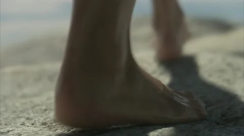 Bare feet walking on cliffs, close-up, Huvudskar, Stockholm archipelago Stock Footage 11311226