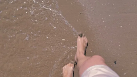Bare feet walking to the seashore Stock Footage 124375197