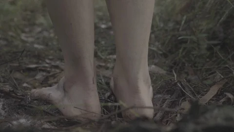 Bare feet walking through jungle forest floor gimbal shot slow motion UNGRADED Stock Footage 101764554