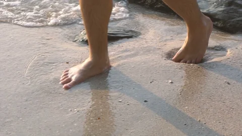 Bare Feet Walking Through Shallow Waves at Beach Stock Footage 126258498