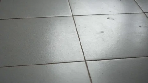 Bare feet, walking on tiles. Stock Footage 74504403