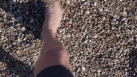 Bare foot moving over pebbles on beach, relaxation Stock Footage 327830789