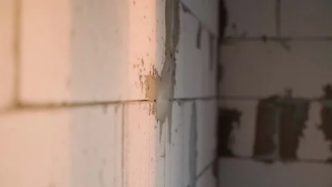 A bare gas-block wall at a construction site, close-up. Brickwork from aerated Stock Footage 235421214