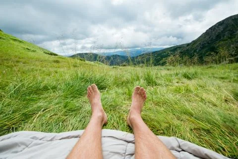 Bare legs of a man outdoors Stock Photos