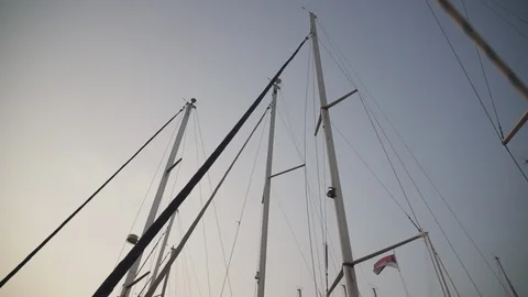 Bare masts at sunset Video stock 128236381
