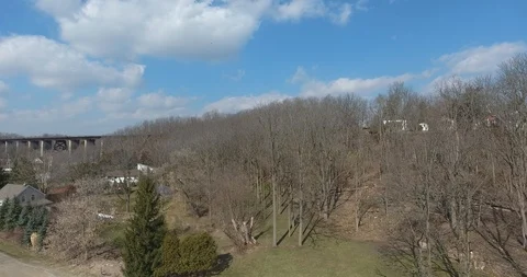Bare Trees In Autumn By Bridge And Small Town Aerial View Stock Footage 88939091