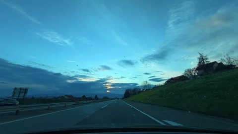 Bare trees frame roadside scenery. Grza River Spring, Serbia Видео 332374128