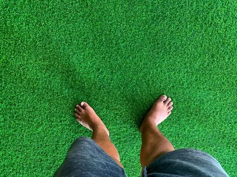 Barefoot on the artificial grass Stock Photos