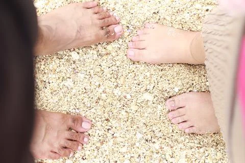 Barefoot on the beach. Stock Photos