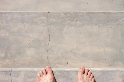 Barefoot on concrete surface Stock Photos