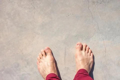 Barefoot on concrete surface Stock Photos