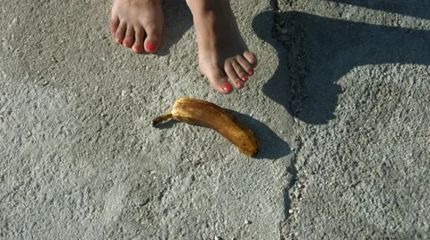 Barefoot Girl Steps On A Banana Stock Footage