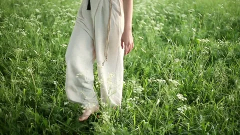 Barefoot on the grass Stock Footage 132754228