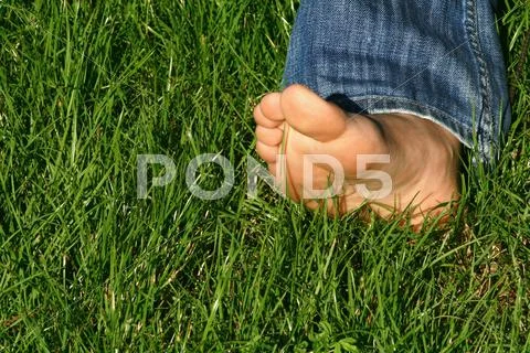 Barefoot in grass Stock Photos
