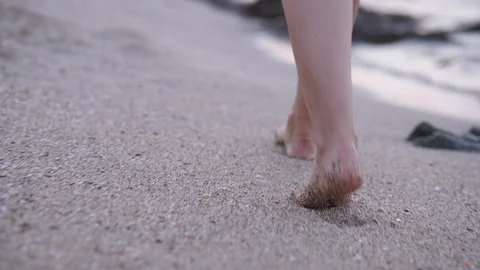 Barefoot legs walking on send at sea beach Stock Footage 104710120