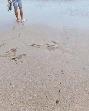 Barefoot man on a beach Stock Photos