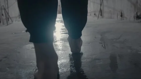 Barefoot man walking through mud Video stock 230314090