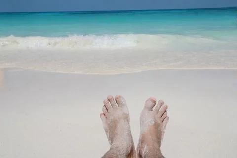 Barefoot on sand beach Stock Photos