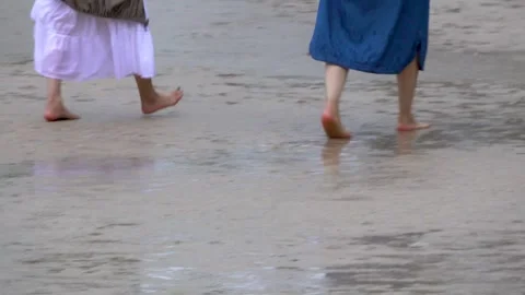 Barefoot Steps on a Wet Rainy Beach's Sand Stock Footage 313211078
