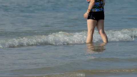 Barefoot tropical beach walking Stock Footage 128673359