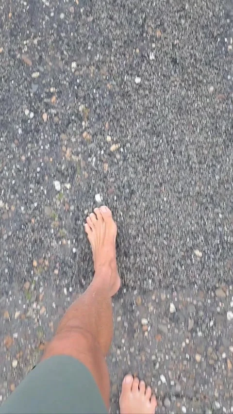 Barefoot walking on asphalt/tarmac Stock Footage 315653785