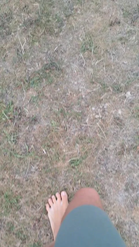 Barefoot walking on grass Stock Footage 315653801