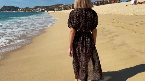 Barefoot walking through sand beach Stock Footage 154728386