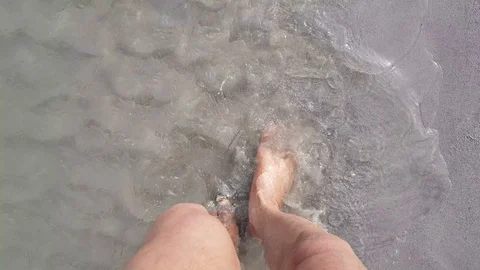 Barefoot walking in water Stock Footage 106709882