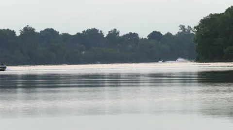 Barefoot Waterskiier moving across frame with large roostertail Stock Footage 54120553
