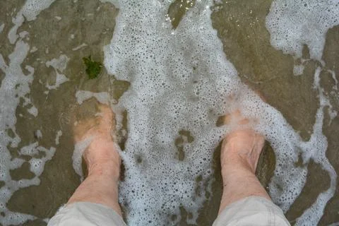 Barefoot in  a wave Stock Photos