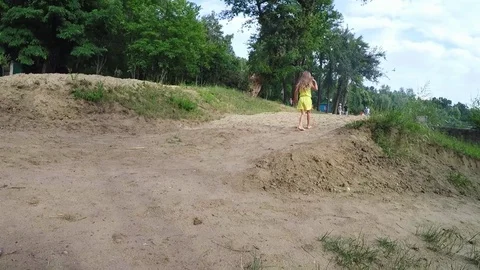 Barefooted child on sandy trail Stock Footage 77085245