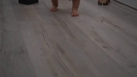 Barefooted toddler boy walks towards the camera. Slow motion shot Stock-Footage 80131053