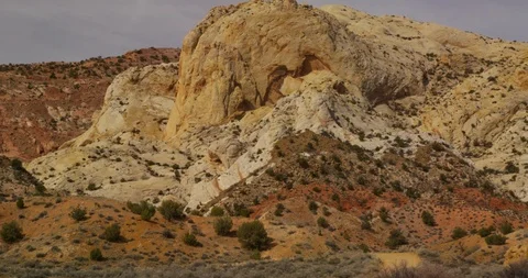 Barely visible SUV ascending the sheer Burr Trail Switchbacks, Utah Stock Footage 124240787