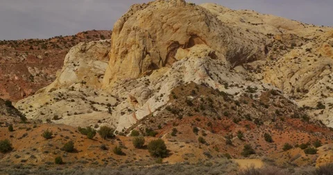 Barely visible SUV ascending the sheer Burr Trail Switchbacks, Utah Stock Footage 124251367