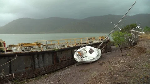 Barge And Yacht Washed Ashore In Aftermath Of Large Hurricane Stock Footage