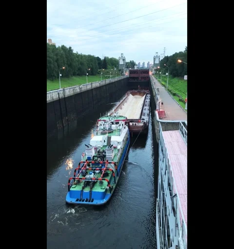 Barge in the canal gateway Stock Footage 317478950
