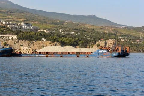 Barge with crushed stone. Photos