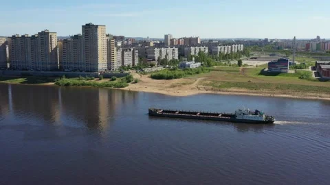 A barge is floating on the river Stock Footage 132779803