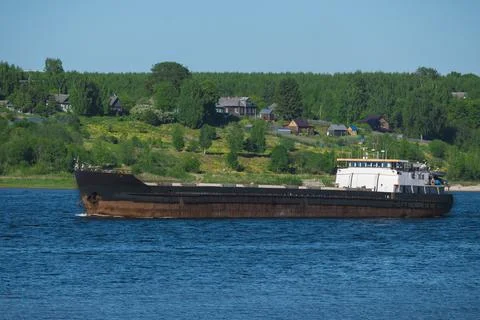 The barge is floating on the river Stock Photos