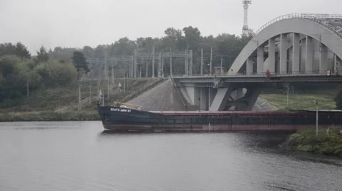 The barge floats on the River under the bridge Stock Footage 54460644