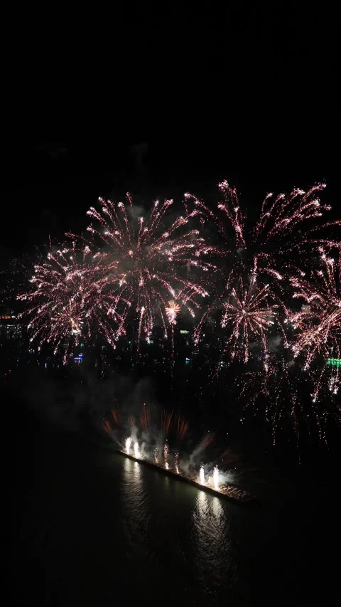 Barge Launching Fireworks Display Over Pattaya, Thailand at Night Stock Footage 335843587
