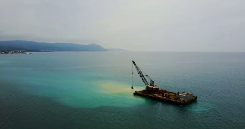 Barge lifts the sand using a ladle from the bottom of the sea. Stock Footage 74479490