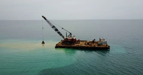 Barge lifts the sand using a ladle from the bottom of the sea. Stock Footage 76286437