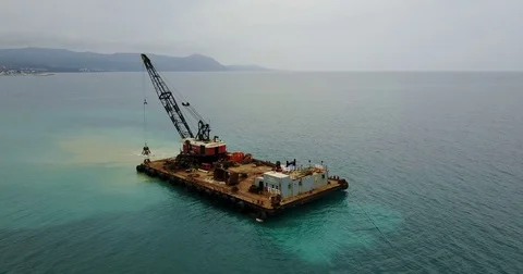 Barge lifts the sand using a ladle from the bottom of the sea Stock Footage 76857243
