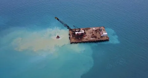 Barge lifts the sand using a ladle from the bottom of the sea Stock Footage 76863918