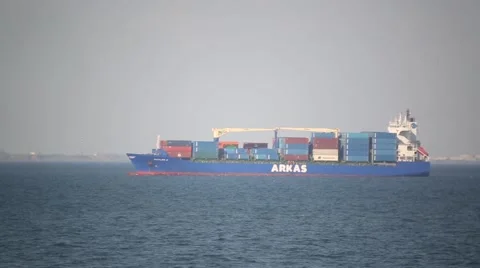 Barge loaded with large containers slowly comes into port Stock Footage 59998489
