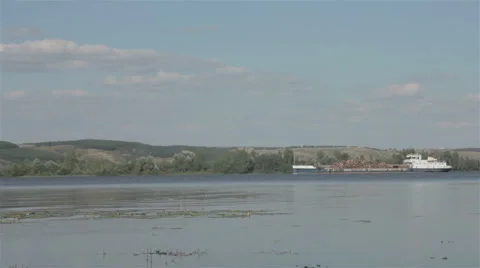 Barge with logs floating on the river Stock Footage 67082023