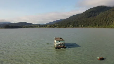 Barge mobile float camp on an inlet on the Kenai Peninsula Stock Footage 240169590